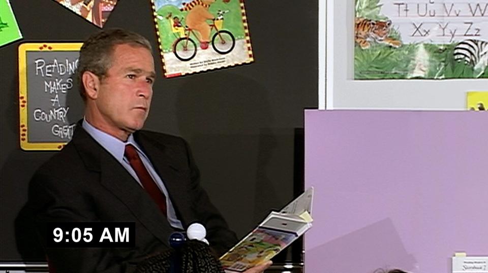 President George W. Bush reading to students in a classroom, as the terrorist attacks were taking place, 9/11/2001.