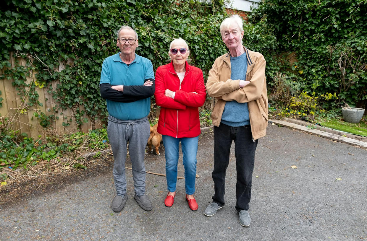 (L-R) Residents David Rushforth, Barbara Firth and Ian Morris in the remains of the garden which they say was destroyed by a team of contractors. (SWNS)