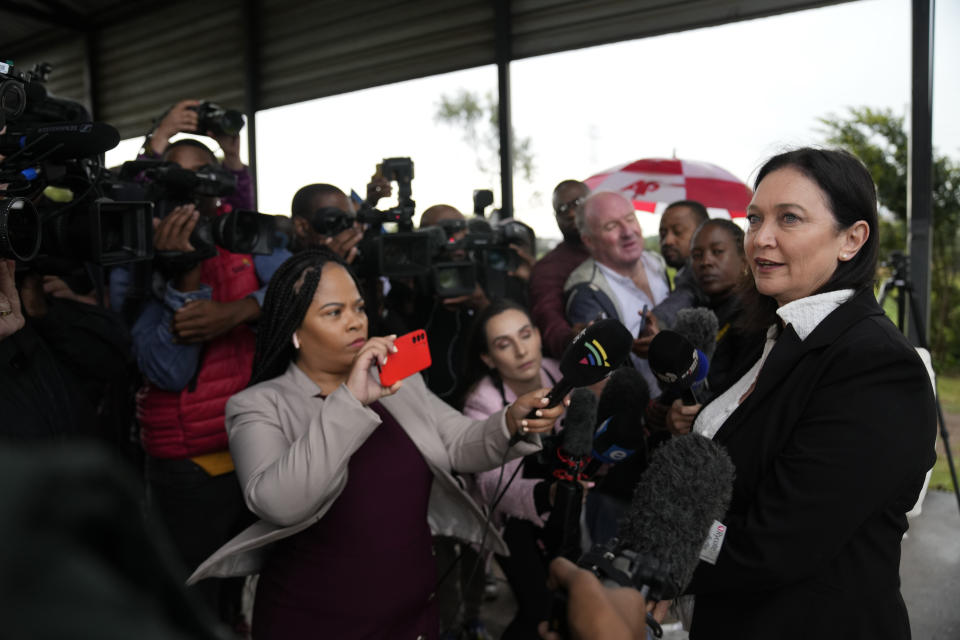 Tania Koen, a lawyer representing the parents of Reeva Steenkamp, speaks to the press, outside the Atteridgeville Prison, ahead of a parole hearing for Oscar Pistorius, in Pretoria, South Africa, Friday, March 31, 2023. The parents of Reeva Steenkamp, the woman Oscar Pistorius shot dead 10 years ago, will oppose the former Olympic runner's application for parole, their lawyer said Friday. (AP Photo/Themba Hadebe)