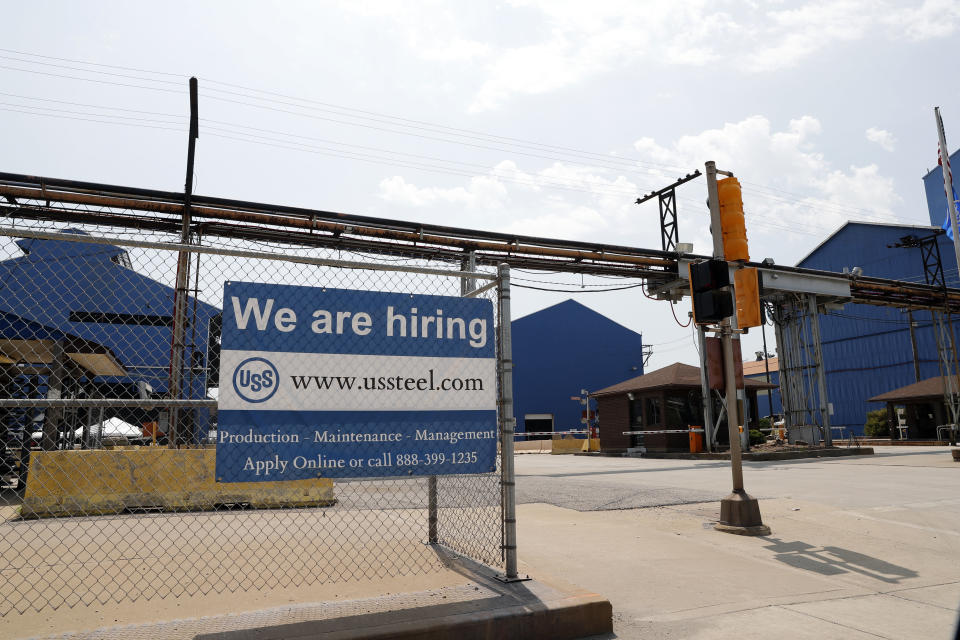 FILE- In this June 28, 2018, file photo, a help wanted sign hangs outside the U.S. Steel Granite City Works facility in Granite City, Ill. On Tuesday, Sept. 11, the Labor Department reports on job openings and labor turnover for July. (AP Photo/Jeff Roberson, File)