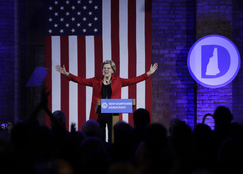 Democratic presidential candidate Sen. Elizabeth Warren, D-Mass., acknowledges applause at the New Hampshire Democratic Party's 60th Annual McIntyre-Shaheen 100 Club Dinner, Friday, Feb. 22, 2019, in Manchester, N.H. (AP Photo/Elise Amendola)