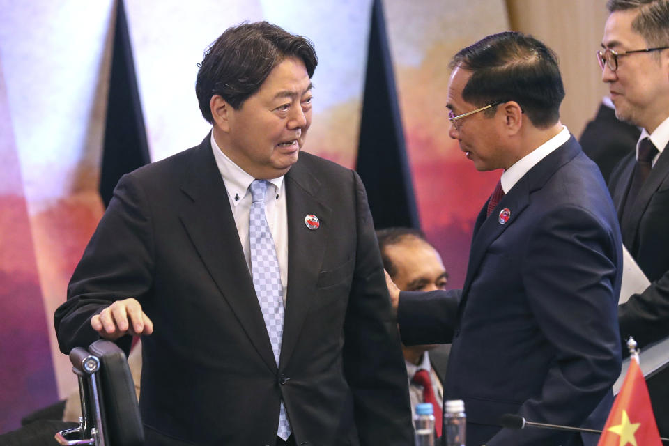 Japan's Foreign Minister Yoshimasa Hayashi, left, talks with Ministerial Vietnam's Foreign Minister Bui Thanh Son during the ASEAN Post Conference with Japan at the Association of Southeast Asian Nations (ASEAN) Foreign Ministers' Meeting in Jakarta, Indonesia, Thursday, July 13, 2023. (Bagus Indahono/Pool Photo via AP)