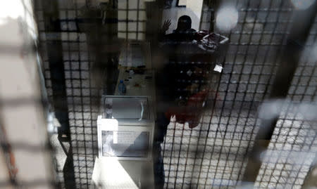 A ballot box is pictured through a window at a polling station during the parliamentary election in Algiers, Algeria May 4, 2017. REUTERS/Zohra Bensemra