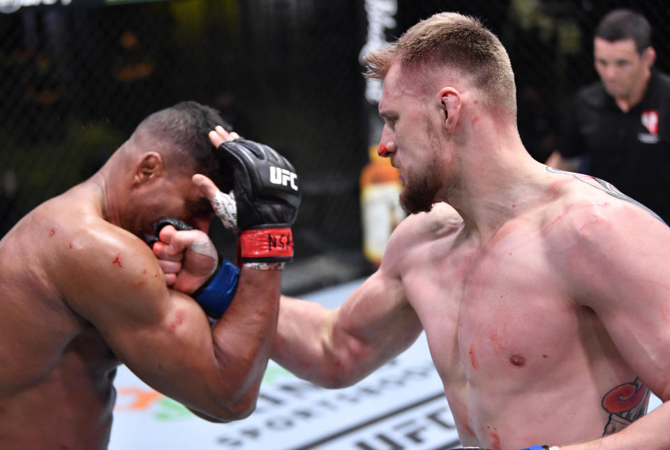LAS VEGAS, NEVADA - FEBRUARY 06: (R-L) Alexander Volkov of Russia punches Alistair Overeem of the Netherlands in their heavyweight fight during the UFC Fight Night event at UFC APEX on February 06, 2021 in Las Vegas, Nevada. (Photo by Chris Unger/Zuffa LLC)