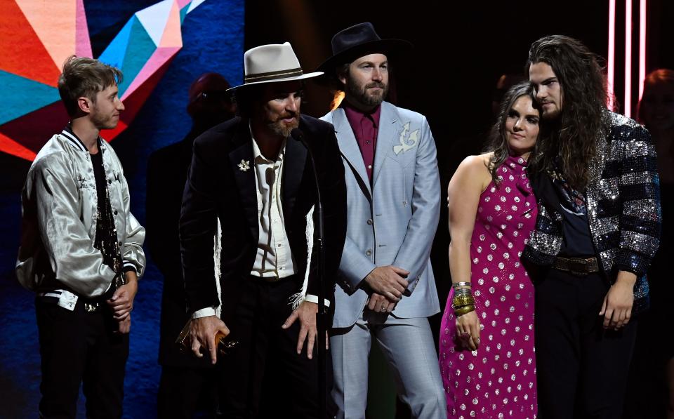 Andrew Bergthold, left, Scott Cash, Ed Cash, Franni Rae Cash, and Martin Cash of the group We The Kingdom accept the Contemporary Christian Artist of the Year Award during the 52nd GMA Dove Awards on Tuesday, October 19, 2021, in Nashville, Tenn. 