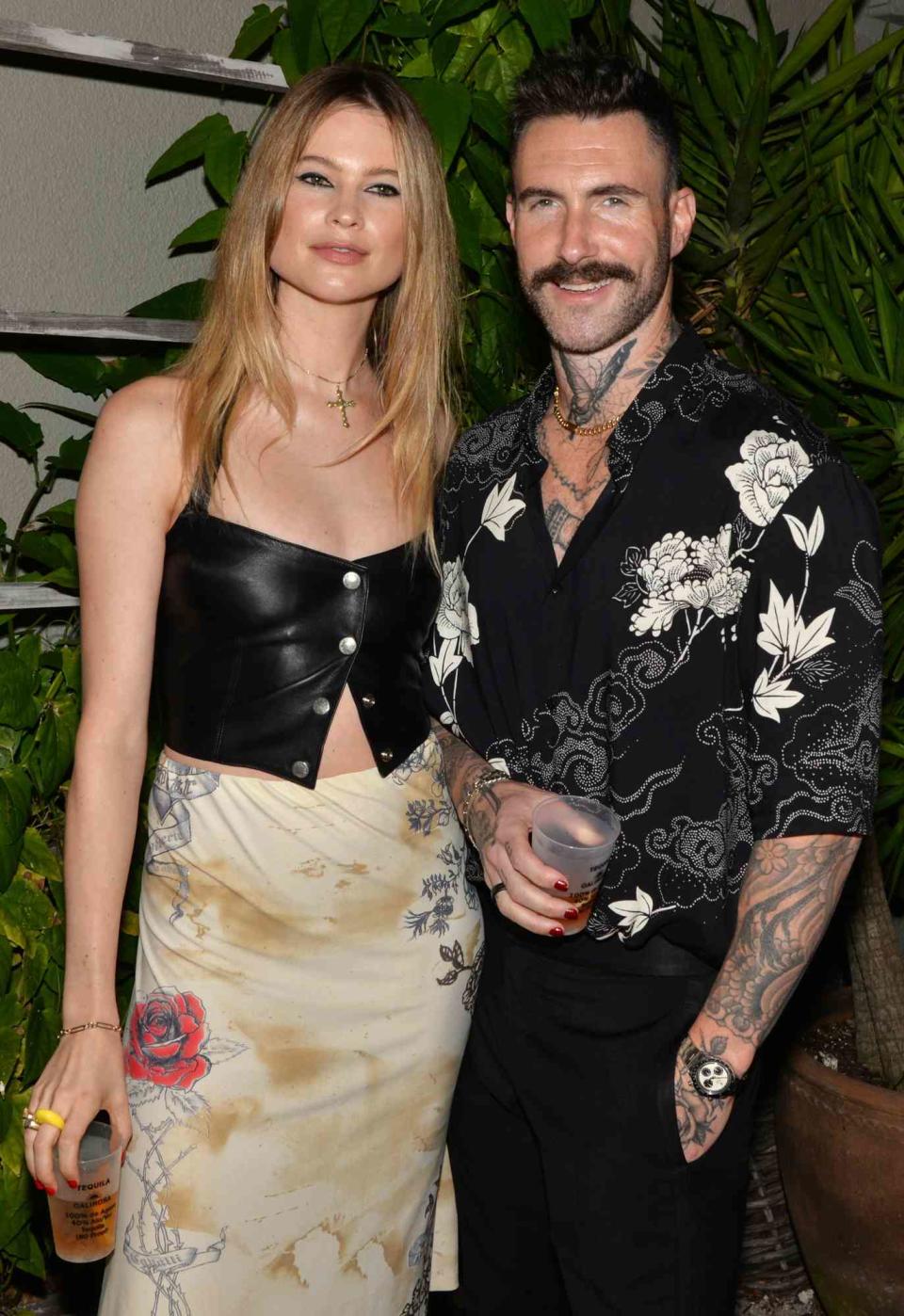 Behati Prinsloo and Adam Levine at the Calirosa Tequila Sunset Happy Hour at South Beach Wine & Food Festival on February 24th, 2022 in Miami Beach, Florida