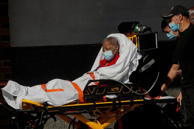 A patient arrives at the Emergency entrance to Maimonides Medical Center in the Borough Park neighborhood of Brooklyn, New York