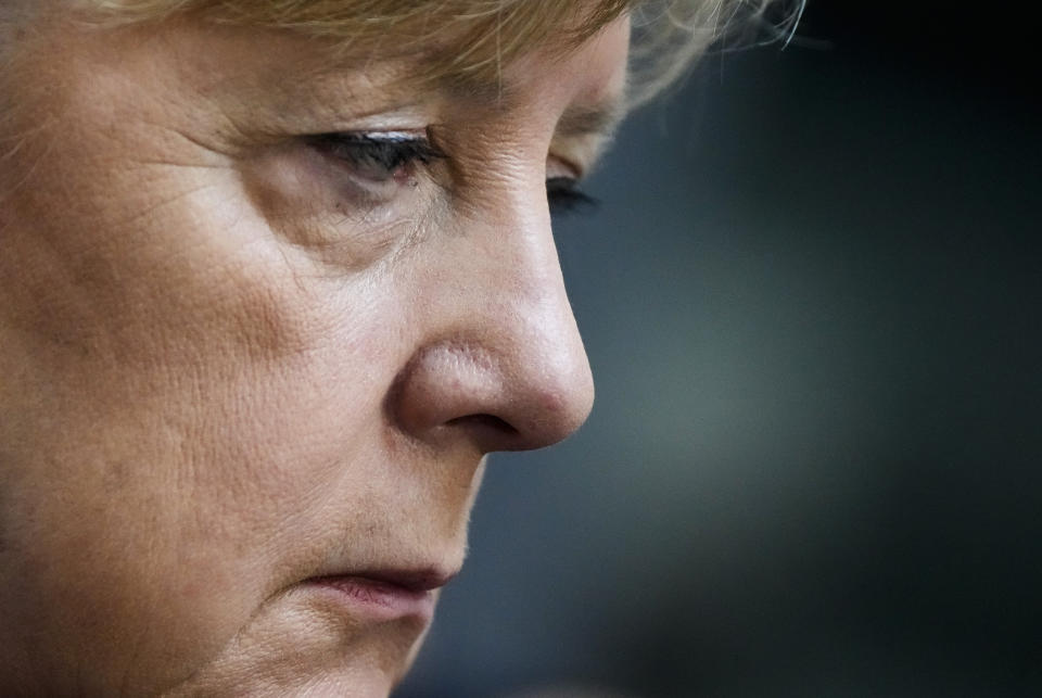 Chancellor Abgela Merkel sits on the visitors tribune as she attends the constituent session of German parliament at the Reichstag building in Berlin, Tuesday, Oct. 26, 2021. Following the national elections on September 26th, the parliament Bundestag meet for the constituent parliamentary session. (AP Photo/Markus Schreiber)