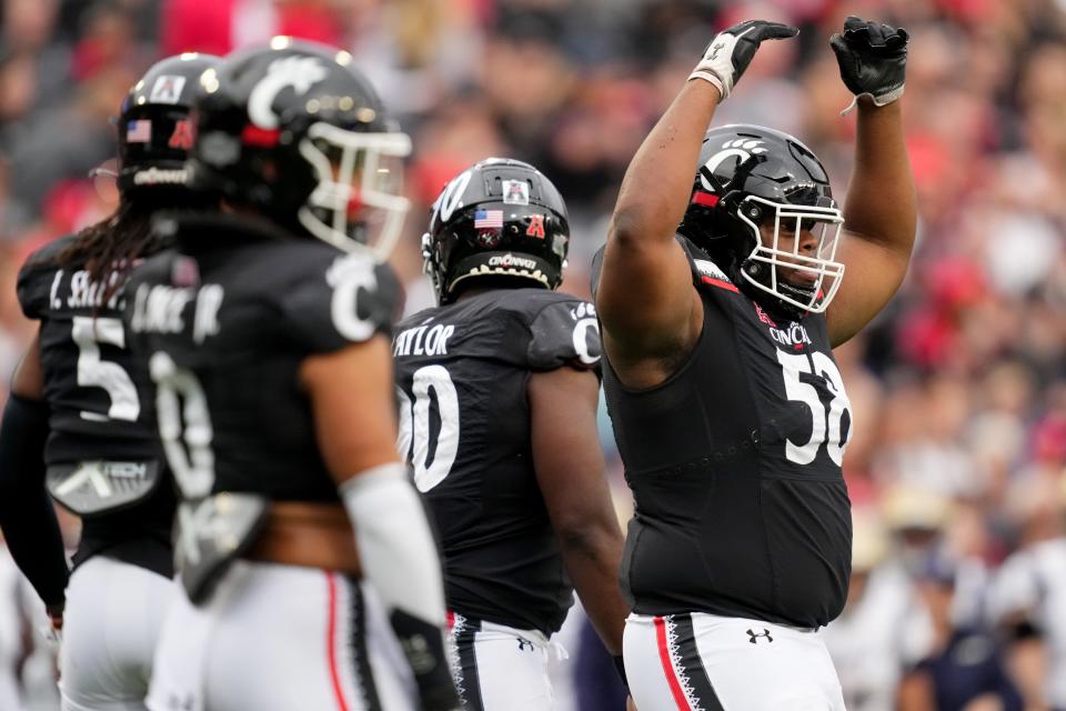 Cincinnati Bearcats defensive lineman Dontay Corleone (58) pumps up the crowd between plays in the first quarter during a college football game against the Navy Midshipmen, Saturday, Nov. 5, 2022, at Nippert Stadium in Cincinnati. 