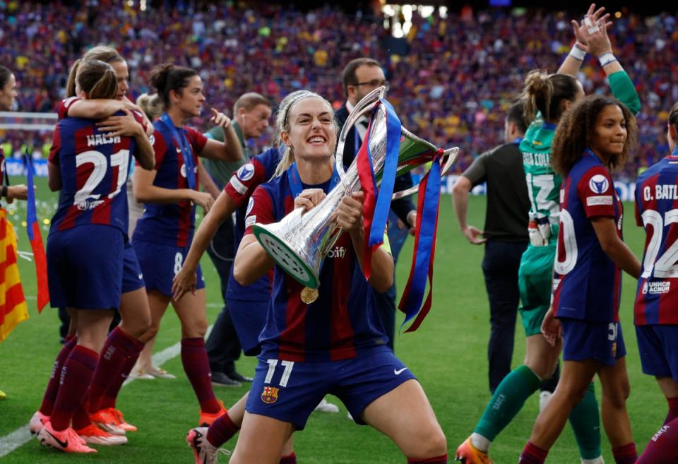 Alexia Putellas celebrates with the Champions League trophy after Barcelona defeated Lyon in Bilbao  (Reuters)