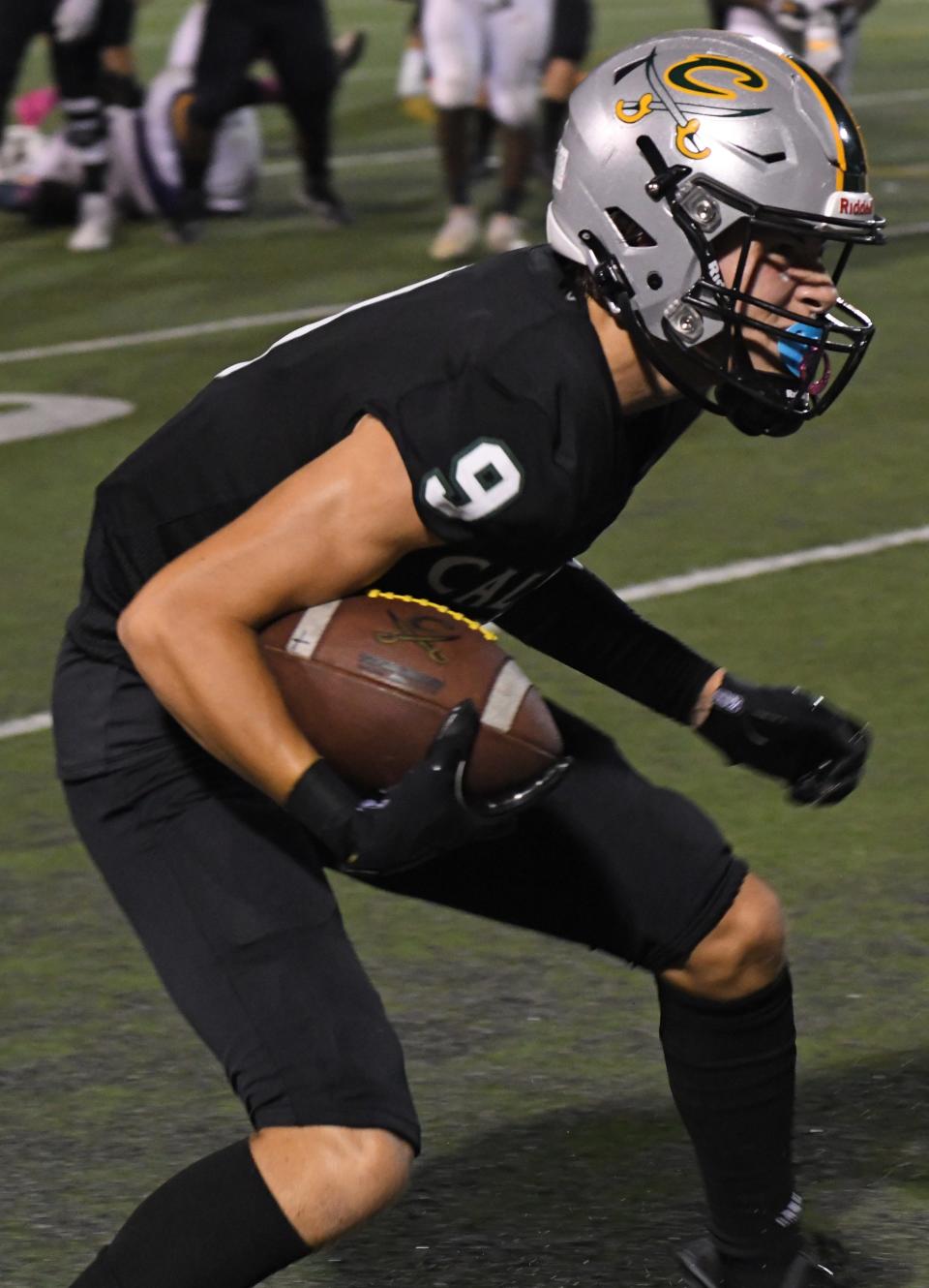 Calvary's Aubrey Hermes makes a catch against Homer in a District 1-1A football game.