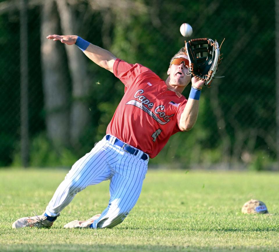 Zach Ehrhard of Hyannis makes a diving catch on a drive by JC Colon of Wareham.
