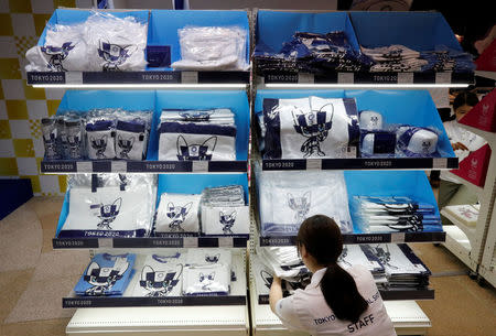 A staff member arranges products at the Tokyo 2020 Olympic Games mascot house in Tokyo, Japan, July 22, 2018. REUTERS/Kim Kyung-Hoon