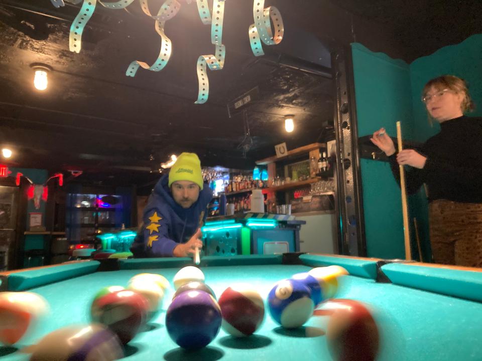 Ben Kinne and Clara Walsh of Montpelier play pool Dec. 3, 2021 at Bent Nails Bistro in Montpelier.