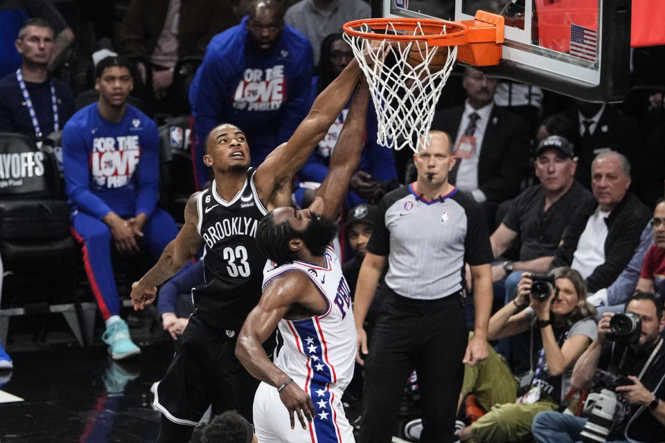 Brooklyn Nets' Nic Claxton (33) blocks a shot by Philadelphia 76ers' James Harden (1) during the first half of Game 4 in an NBA basketball first-round playoff series Saturday, April 22, 2023, in New York. (AP Photo/Frank Franklin II)