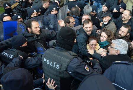 Demonstrators scuffle with riot police during a protest against detention of the head of the Turkish Medical Association (TTB) and 10 other leaders of theÊdoctors' union, in Ankara, Turkey January 30, 2018. REUTERS/Stringer