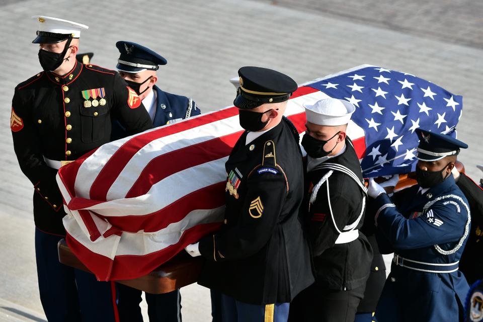 The casket of former Sen. Bob Dole arrives at the U.S. Capitol in Washington, where he will lie in state, Thursday, Dec. 9, 2021. (Mandel Ngan/Pool via AP)