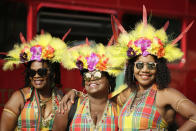 <p>Costumed revellers pose for a photo, ahead of the parade during the Notting Hill Carnival in London, Monday, Aug. 27, 2018. (Photo: Tim Ireland/AP) </p>