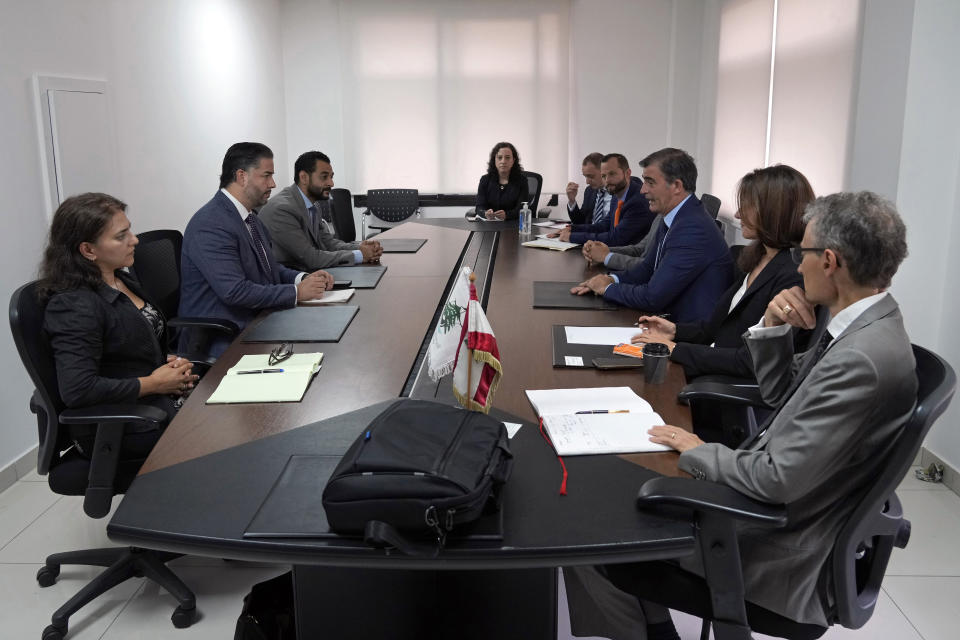 FILE - Lebanese caretaker Minister of Economy and Trade Amin Salam, second left, meets with a delegation from the International Monetary Fund in Beirut, Lebanon, Tuesday, Sept. 20, 2022. Four years into Lebanon's historic economic meltdown, Lebanon's elites are pushing an economic recovery plan that would sidestep critical reforms demanded by the International Monetary Fund. (AP Photo/Bilal Hussein, File)