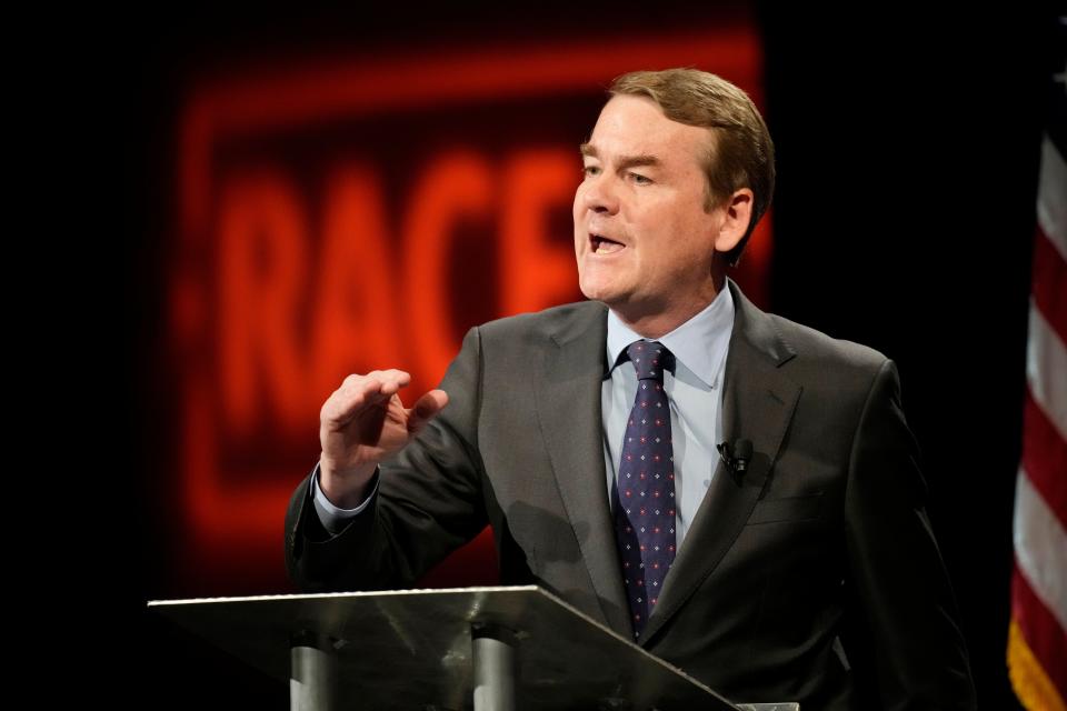 Democratic U.S. Sen. Michael Bennet speaks during a debate with Republican challenger Joe O'Dea, Friday, Oct. 28, 2022, on the campus of Colorado State University in Fort Collins, Colo. (AP Photo/David Zalubowski)