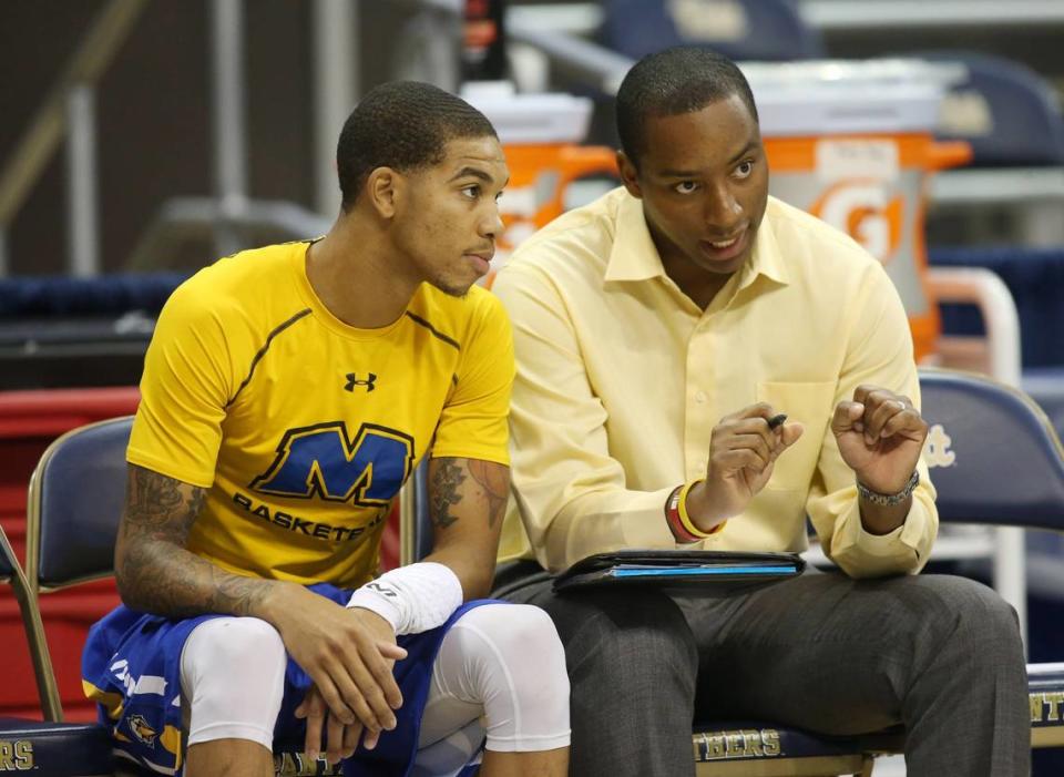 Morehead State guard Xavier Moon, left, talks with director of basketball operations Jonathan Mattox before a game against Pittsburgh on Nov. 25, 2016.