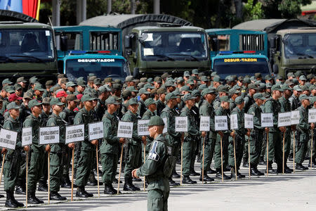 Soldiers standing in formation before the start of a ceremony to kick off the distribution of security forcers and voting materials to be used in the upcoming presidential elections, at Fort Tiuna military base in Caracas, Venezuela May 15, 2018. REUTERS/Carlos Jasso