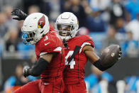 Arizona Cardinals safety Jalen Thompson (34) celebrates with safety Budda Baker after an interception against the Carolina Panthers during the first half of an NFL football game on Sunday, Oct. 2, 2022, in Charlotte, N.C. (AP Photo/Rusty Jones)