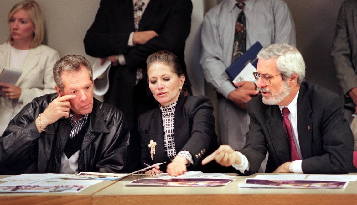 This photo from Feb. 2, 1997, shows Judy Weiser, center, with Stanley Arkin, left, and Stuart L. Blumberg reviewing urban planner Jonathan Barnett’s rendering and map showing his vision for downtown Miami.