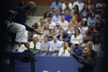 Sep 8, 2018; New York, NY, USA; Serena Williams of the United States gestures to umpire Carlos Ramos (L) after being assessed a game penalty in her match against Naomi Osaka of Japan (not pictured) in the women's final on day thirteen of the 2018 U.S. Open tennis tournament at USTA Billie Jean King National Tennis Center. Mandatory Credit: Geoff Burke-USA TODAY Sports