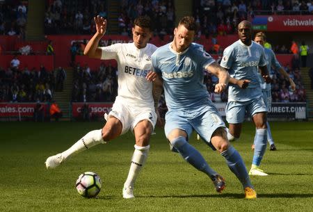 Britain Soccer Football - Swansea City v Stoke City - Premier League - Liberty Stadium - 22/4/17 Swansea City's Kyle Naughton in action with Stoke City's Marko Arnautovic Reuters / Rebecca Naden Livepic