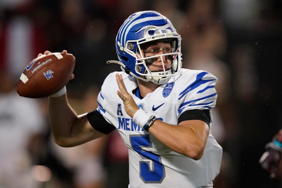 Memphis quarterback Seth Henigan (5) sets up to pass against Mississippi State during the first half of an NCAA college football game in Starkville, Miss., Saturday, Sept. 3, 2022. (AP Photo/Rogelio V. Solis)