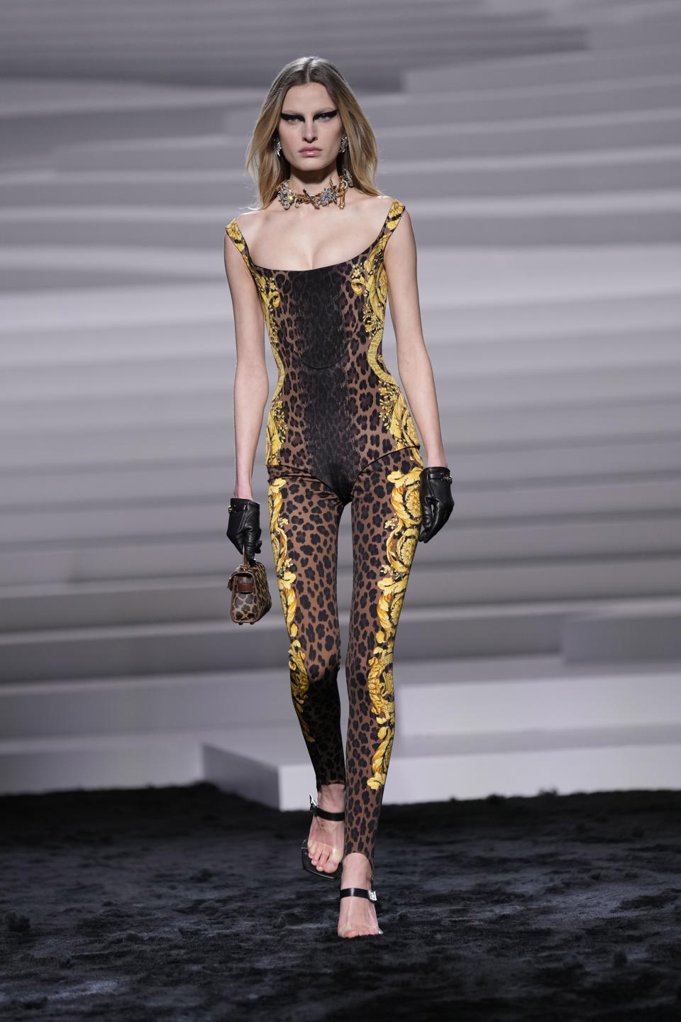 A model wears a creation as part of the Versace women's Fall-Winter 2024-25 collection presented in Milan, Italy, Friday, Feb. 23, 2024. (AP Photo/Antonio Calanni)