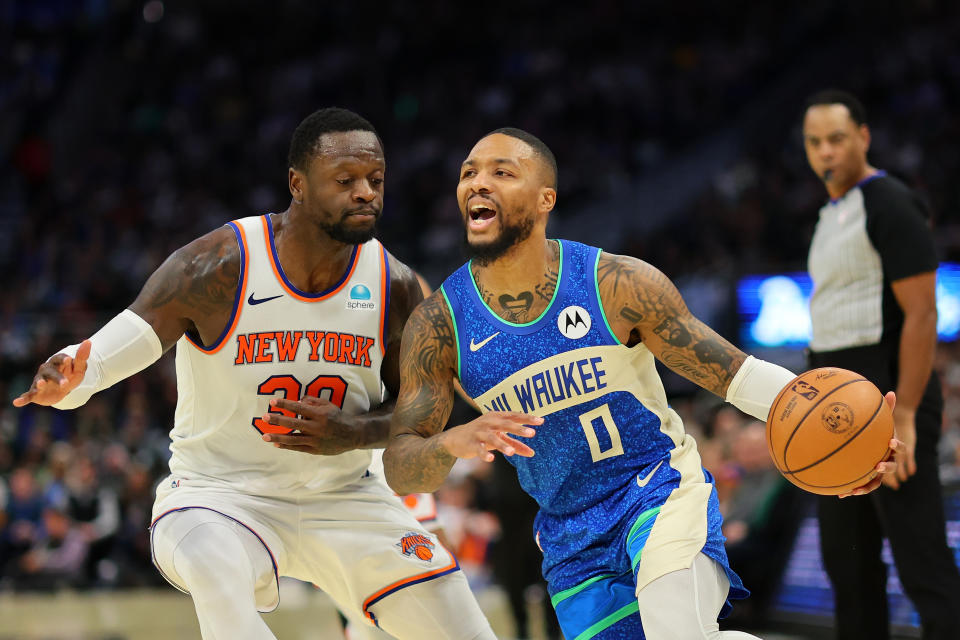 Milwaukee's Damian Lillard is defended by New York's Julius Randle during the first half of the NBA in-season tournament quarterfinal at Fiserv Forum in Milwaukee, on Dec. 5, 2023. (Photo by Stacy Revere/Getty Images)