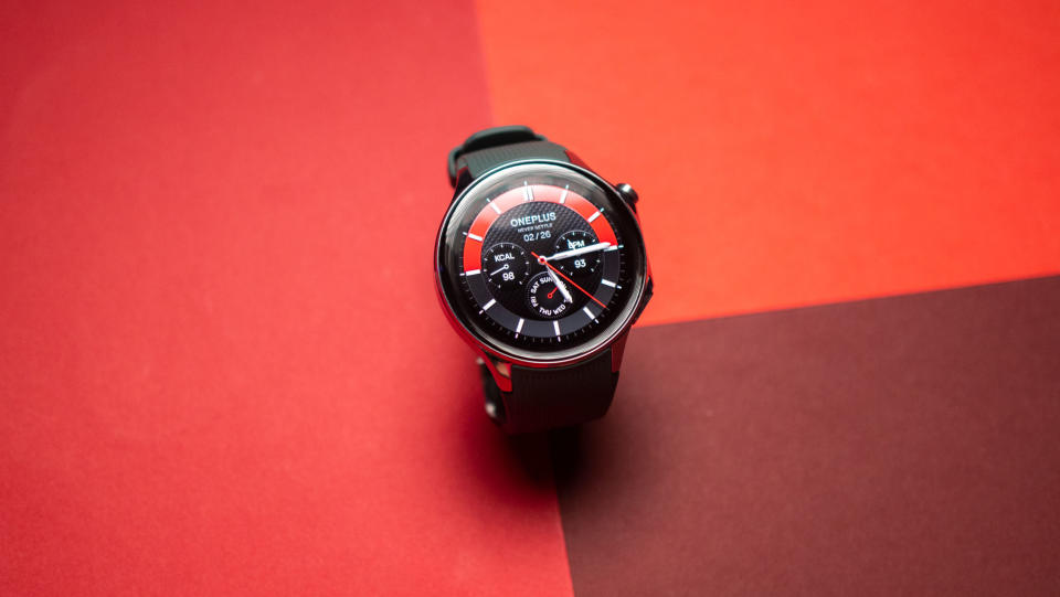 OnePlus Watch 2 watch face on red background