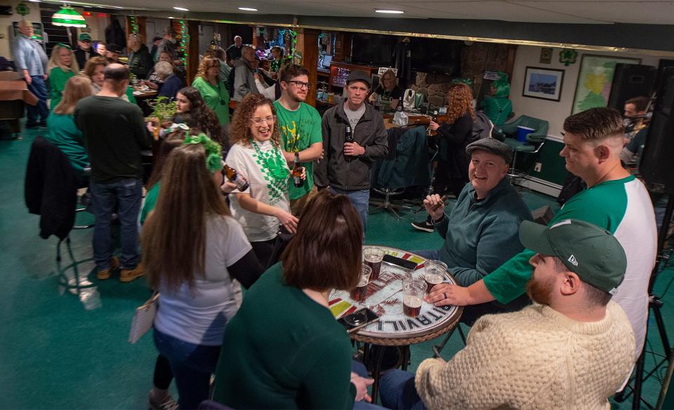A crowd celebrates St. Patrick's Day during a Hoolie celebration at the Ancient Order of Hibnerians, Division 1, in Bristol Borough, on Saturday, Mar. 12, 2022.