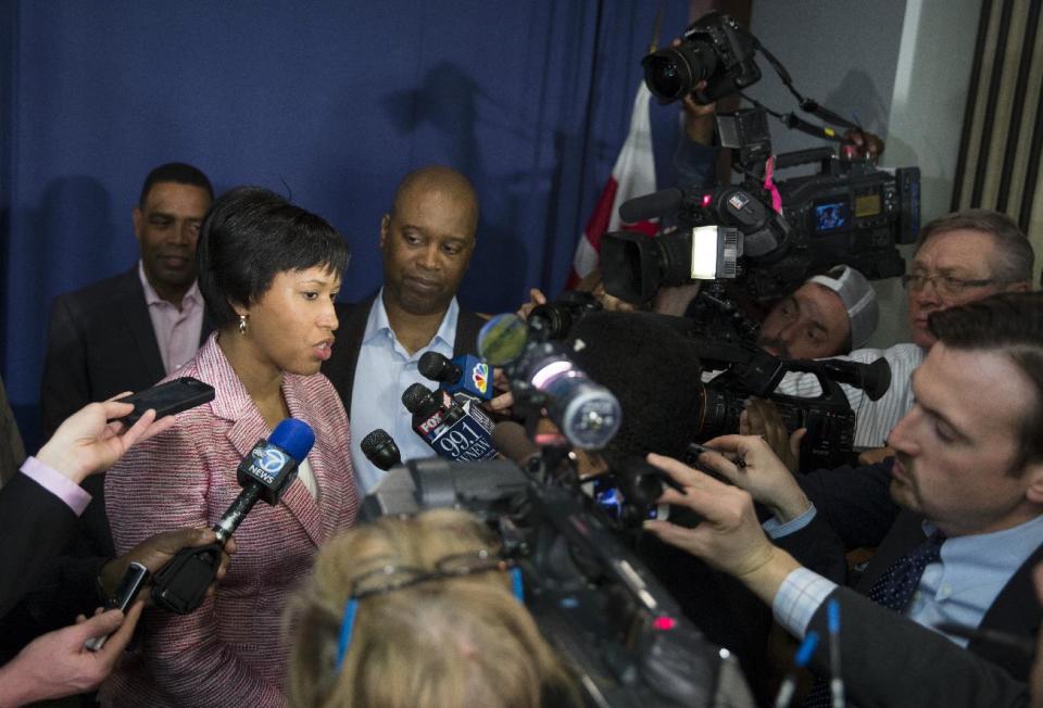 Washington Democratic Mayoral nominee Muriel Bowser talks with reporters after a news conference to talk about her primary victory, Wednesday, April 2, 2014, at the National Press Club in Washington. Councilmember Bowser defeated Mayor Vincent Gray in Tuesday's Democratic mayoral primary, leaving Gray to serve nine months as a lame duck with potential criminal charges hanging over his head. (AP Photo/ Evan Vucci)