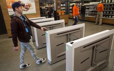 A shopper enters the new Amazon Go store - Credit: Bloomberg