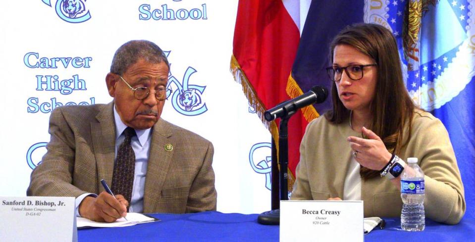 U.S. Congressman Sanford D. Bishop, left, takes notes as Becca Creasy, who owns 920 Cattle with her husband Jarrod, talks about their business during a roundtable discussion Friday at G.W. Carver High School in Columbus, Georgia. 05/17/2024