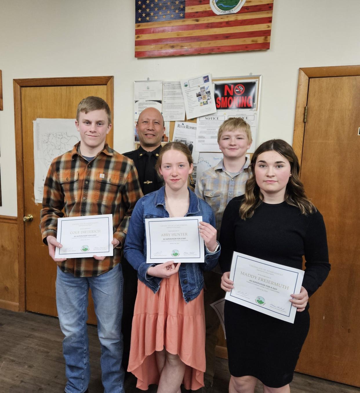 Damascus Township Constable Chris Lee with the four Damascus School eighth graders on March 18, 2024. The students, from left in front, are Cole Dieterich, Abby Hunter and Maddy Freiermuth. In back next to the constable is Brayden Maciejewski.