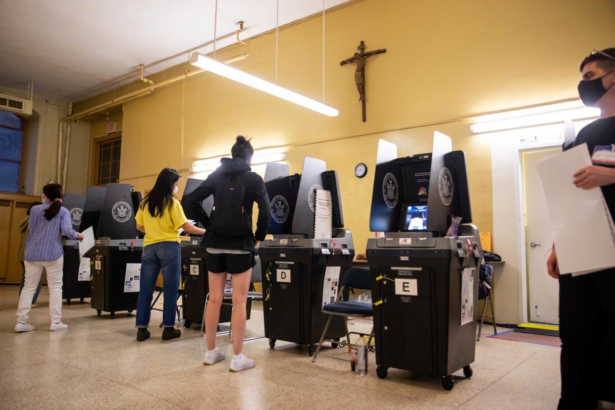 Voters scan completed ballots at the Church of St. Anthony of Padua polling site during the New York City mayoral primary election on June 22. 