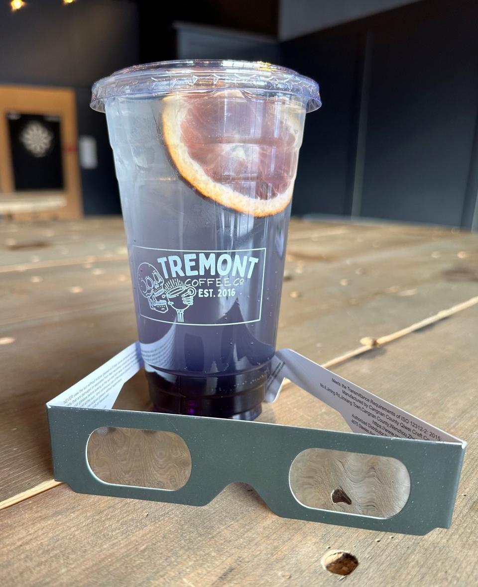 Tremont Coffee Company's Berry Eclipse Burst is a berry-sweetened natural energy drink, served cold with a side of eclipse glasses.
