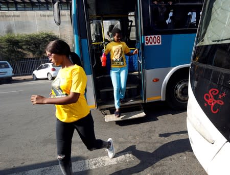 Supporters of the former President Jacob Zuma arrive, as he appears in the High Court where he faces charges that include fraud, corruption and racketeering, in Pietermaritzburg