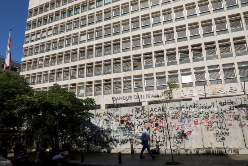 FILE PHOTO: A man walks past the Central Bank building, in Beirut