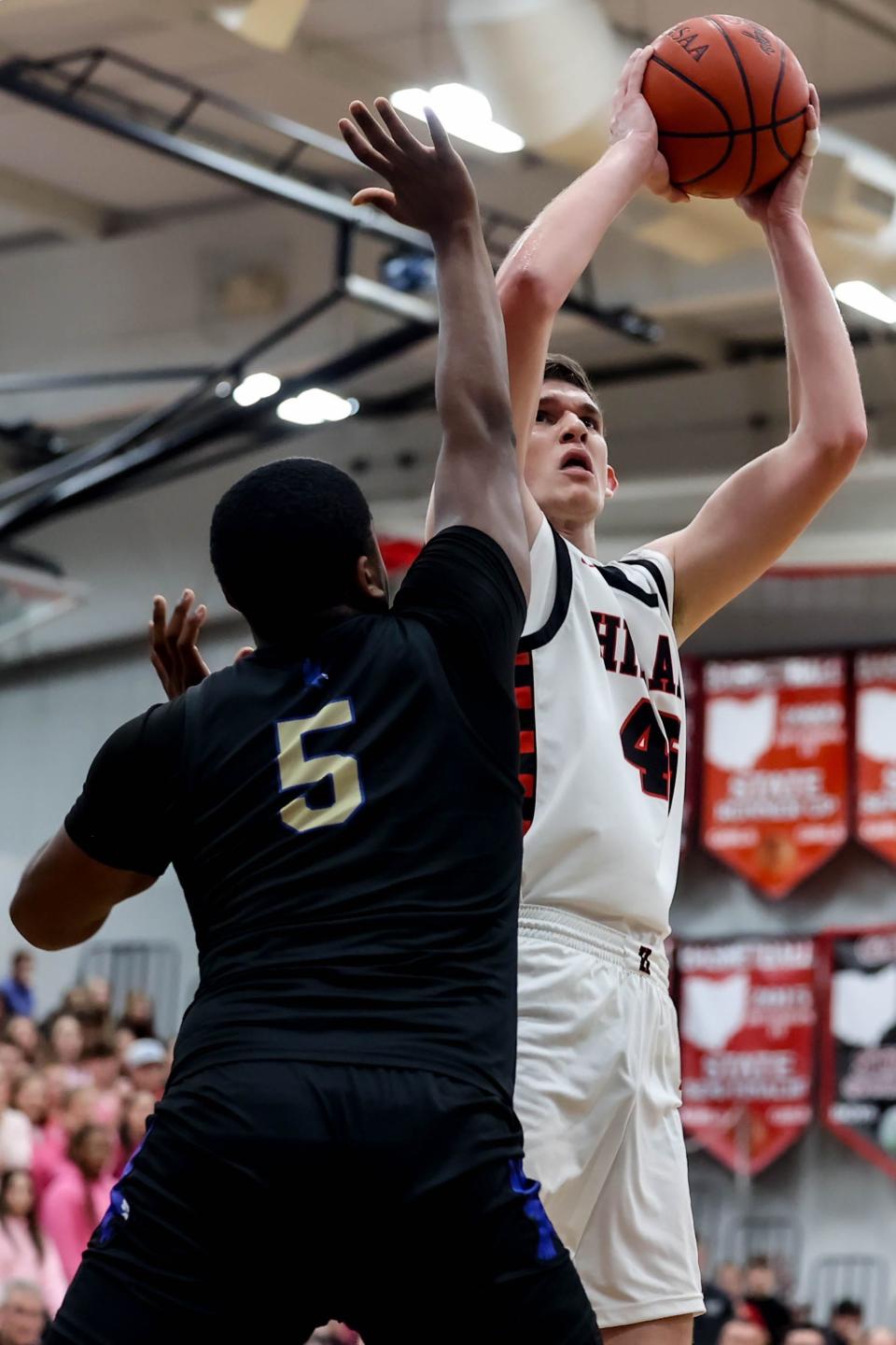 Hiland's Alex Yoder fires this shot over Lutheran East defender Allan Mallory.