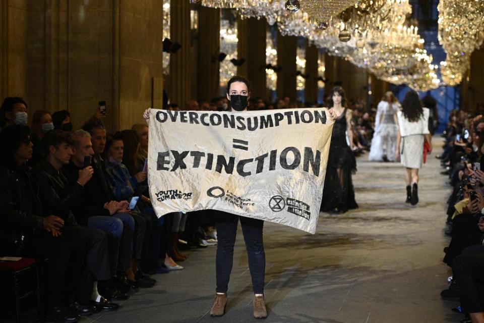 Demonstrations on the Louis Vuitton catwalk (AFP via Getty Images)