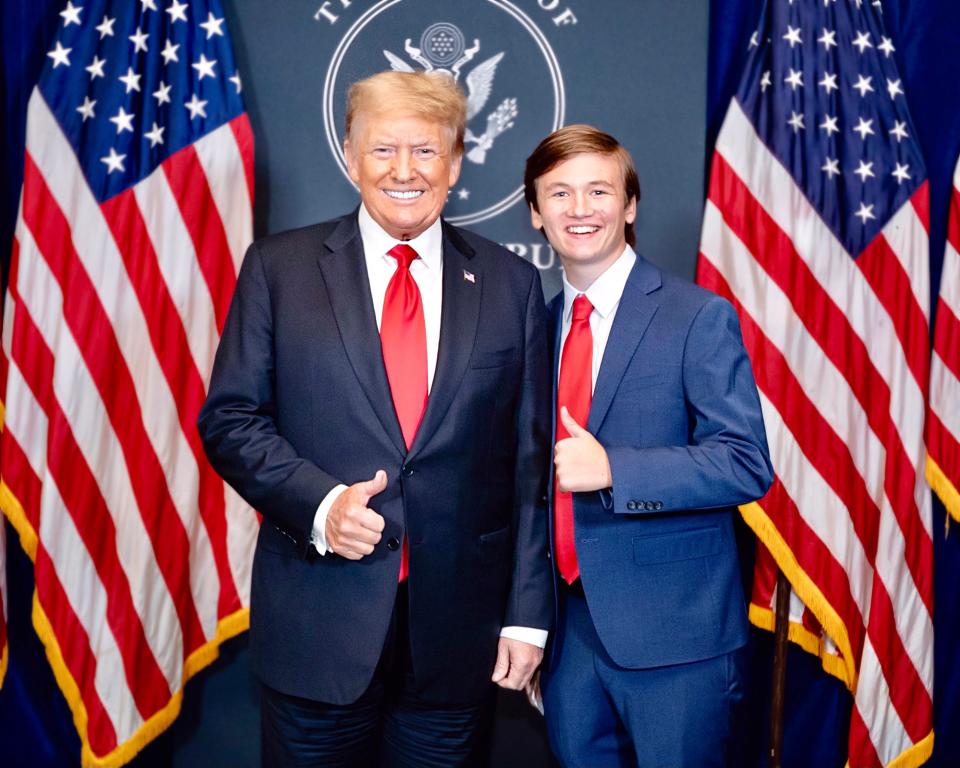 Tuscaloosa native Brilyn Hollyhand poses with former president Donald Trump before Trump's September 2021 rally in Cullman