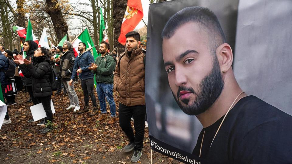PHOTO: Protesters hold flags and posters of Iranian hip-hop artist Toomaj Salehi who was arrested for backing anti-government protests. (Charles M. Vella/SOPA Images/LightRocket via Getty Images)