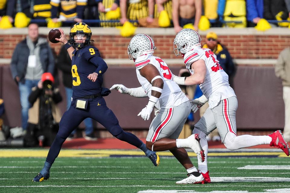 Michigan quarterback J.J. McCarthy looks to pass against Ohio State during the first half at Michigan Stadium in Ann Arbor on Saturday, Nov. 25, 2023.