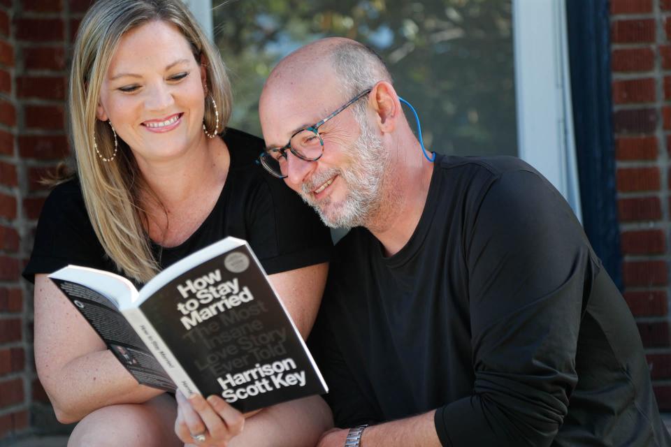 Harrison and Lauren Key look through an advace copy of their book "How to Stay Married".