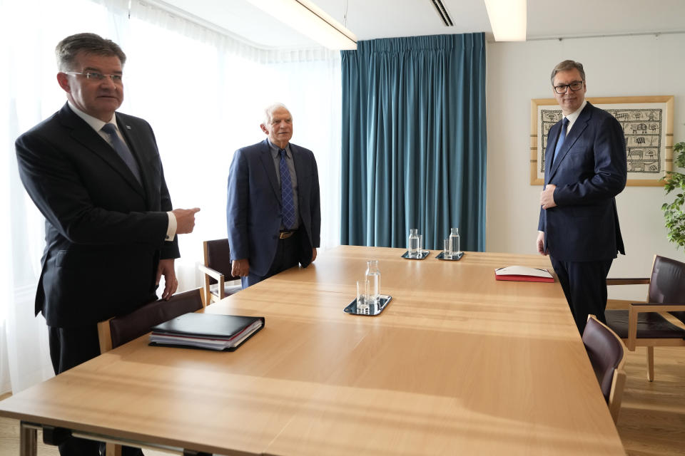 Serbia's President Aleksandar Vucic, right, EU Special Representative Miroslav Lajcak, left, and European Union foreign policy chief Josep Borrell wait for the start of a meeting in Brussels, Thursday, Sept. 14, 2023. The leaders of Serbia and Kosovo are holding a fresh round of meetings on Thursday aimed at improving their strained relations as calls mount for a change in the Western diplomatic approach toward them amid concern that their tensions could spiral out of control. (AP Photo/Virginia Mayo)